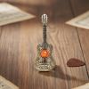 Испанская гитара из латуни и янтаря – брошь ручной работы Испанская гитара из латуни и янтаря – брошь ручной работы