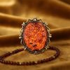 Янтаровая брошь-камея "Цветок" – роскошный аксессуар из латуни и натурального янтаря. Янтаровая брошь-камея "Цветок" – роскошный аксессуар из латуни и натурального янтаря.